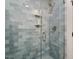 Walk-in shower with blue tiling and built-in niche at 35 Rogerson Dr, Chapel Hill, NC 27517