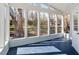 Spacious sunroom with multiple windows offering picturesque views of backyard at 35 Rogerson Dr, Chapel Hill, NC 27517