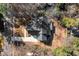 Aerial view of a newly constructed home with a pristine driveway and surrounding landscaping at 3513 Eden Croft Dr, Raleigh, NC 27612