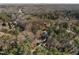 Expansive aerial view showing homes surrounded by lush trees within the city at 3513 Eden Croft Dr, Raleigh, NC 27612