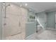 A luxurious bathroom features a glass shower and separate tub, complemented by soft, natural light at 3513 Eden Croft Dr, Raleigh, NC 27612