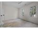 Bedroom features windows, white trim and is awaiting new flooring at 3513 Eden Croft Dr, Raleigh, NC 27612