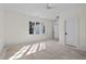 Large bedroom with ceiling fan and double windows to let in natural light at 3513 Eden Croft Dr, Raleigh, NC 27612
