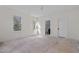 Bright bedroom with two windows, white trim, and freshly installed floors ready for final installation at 3513 Eden Croft Dr, Raleigh, NC 27612