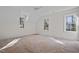 Light and airy bedroom featuring three windows offering natural light and new floors ready to be installed at 3513 Eden Croft Dr, Raleigh, NC 27612