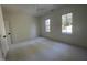 Bright, airy bedroom featuring neutral paint, carpet and two large windows providing ample natural light at 3513 Eden Croft Dr, Raleigh, NC 27612