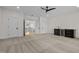 Large bonus room with carpeting, mini bar, black ceiling fan, and doors leading to other parts of the home at 3513 Eden Croft Dr, Raleigh, NC 27612