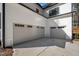 Three-car garage with white doors, clean concrete, and well-maintained exterior at 3513 Eden Croft Dr, Raleigh, NC 27612