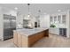 Modern kitchen with stainless steel appliances, granite countertops, and a large island at 3513 Eden Croft Dr, Raleigh, NC 27612