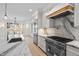 Bright kitchen with stainless steel appliances, marble countertops, and large island at 3513 Eden Croft Dr, Raleigh, NC 27612