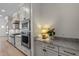 Well-appointed kitchen with marble countertops, white cabinetry, and stainless steel appliances at 3513 Eden Croft Dr, Raleigh, NC 27612