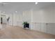 Bright and airy living room with hardwood floors, fireplace, and built in cabinets at 3513 Eden Croft Dr, Raleigh, NC 27612