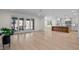 Spacious living room with hardwood floors and sliding glass doors to outdoor living space at 3513 Eden Croft Dr, Raleigh, NC 27612