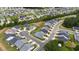 An aerial view captures multiple homes in a planned community with landscaped streets and green spaces at 3528 Olive Glen Dr, Apex, NC 27502