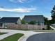 Image of a fenced backyard with green lawn, privacy, and a glimpse of neighboring houses at 3528 Olive Glen Dr, Apex, NC 27502