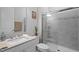 Modern bathroom with a walk-in shower, and a clean, white vanity with ample counter space at 3528 Olive Glen Dr, Apex, NC 27502