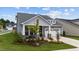 Beautiful home with a well-manicured front yard, stone accents, and a two-car garage at 3528 Olive Glen Dr, Apex, NC 27502