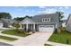 Charming home with a well-manicured lawn, stone accents, and an attached garage at 3528 Olive Glen Dr, Apex, NC 27502
