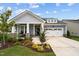 Charming home with landscaped yard, covered porch and two-car garage at 3528 Olive Glen Dr, Apex, NC 27502
