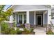 Inviting front porch featuring stone columns and a cozy seating area, perfect for relaxation at 3528 Olive Glen Dr, Apex, NC 27502