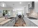 Well-equipped kitchen with a large island, stainless steel appliances and pantry at 3528 Olive Glen Dr, Apex, NC 27502