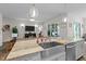 Elegant kitchen featuring a large island with bar seating and stainless sink at 3528 Olive Glen Dr, Apex, NC 27502