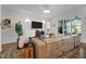Comfortable living room featuring a large sectional, stylish decor and a TV at 3528 Olive Glen Dr, Apex, NC 27502