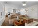 Inviting living room open to the kitchen is perfect for entertaining at 3528 Olive Glen Dr, Apex, NC 27502