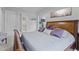 Cozy main bedroom with a luxurious bed, elegant decor, and a view into the en-suite bathroom at 3528 Olive Glen Dr, Apex, NC 27502