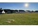 Expansive backyard with green grass and new construction homes in a friendly neighborhood at 38 Flatland Dr, Princeton, NC 27569