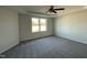 Bedroom with a tray ceiling, neutral walls, gray carpet, and lots of light at 38 Flatland Dr, Princeton, NC 27569