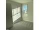 Well-lit bedroom features a window and door, providing a comfortable and inviting space at 38 Flatland Dr, Princeton, NC 27569