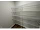 Walk-in closet with wire shelving and wood-look flooring at 38 Flatland Dr, Princeton, NC 27569