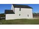Exterior view of a two-story home with gray siding, dark roof, and green lawn at 38 Flatland Dr, Princeton, NC 27569