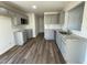 Bright kitchen featuring stainless steel appliances, gray cabinets and granite countertops at 38 Flatland Dr, Princeton, NC 27569