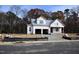 Exterior of a new build home, almost complete, featuring an attached two-car garage and covered front porch at 3821 Fairway View Dr # 11, Fuquay Varina, NC 27526