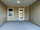 This is an image of the back patio featuring a ceiling light, exterior siding, and a door and window at 39 Flatland Dr, Princeton, NC 27569