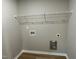 This is an image of the laundry room which features vinyl floors and a wire rack on the wall at 39 Flatland Dr, Princeton, NC 27569