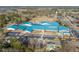 Expansive aerial view of the well-maintained school with blue roofs, large parking lot and surrounding greenery at 405 N Massey St, Selma, NC 27576