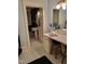 Bathroom vanity with a decorative countertop with black and white tile flooring at 405 N Massey St, Selma, NC 27576