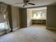 Bedroom with neutral walls, carpet and curtains, including built in shelving at 405 N Massey St, Selma, NC 27576