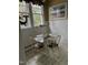 Cozy dining area with a glass table, four chairs, and decorative accents at 405 N Massey St, Selma, NC 27576