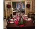 Elegant dining room set with festive decorations and a view into the living room at 405 N Massey St, Selma, NC 27576