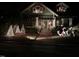 Festively decorated home exterior with wreaths, toy soldiers, reindeer and Christmas trees adding cheerful, holiday spirit at 405 N Massey St, Selma, NC 27576