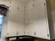 Kitchen cabinets featuring white cabinets with antique bronze hardware at 405 N Massey St, Selma, NC 27576