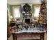 Inviting living room features a Christmas tree, fireplace, and elegant decorations for a festive atmosphere at 405 N Massey St, Selma, NC 27576