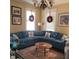 Bright living room features a large sectional sofa, seasonal decor and an area rug at 405 N Massey St, Selma, NC 27576