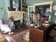 Cozy living room features a fireplace, built-in bookshelves, and elegant decor at 405 N Massey St, Selma, NC 27576