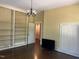 Spacious room with built-in bookshelves, lighting fixture and neutral walls at 405 N Massey St, Selma, NC 27576