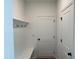 Bright entryway featuring a bench, hooks for coats and bags, and a door to the garage at 4302 Emeline Way # 16, Fuquay Varina, NC 27526